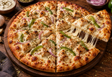 Malai Boti Pizza in Peshawar: Taste & Order Malai boti pizza with creamy chicken, melted mozzarella, onions and capsicum